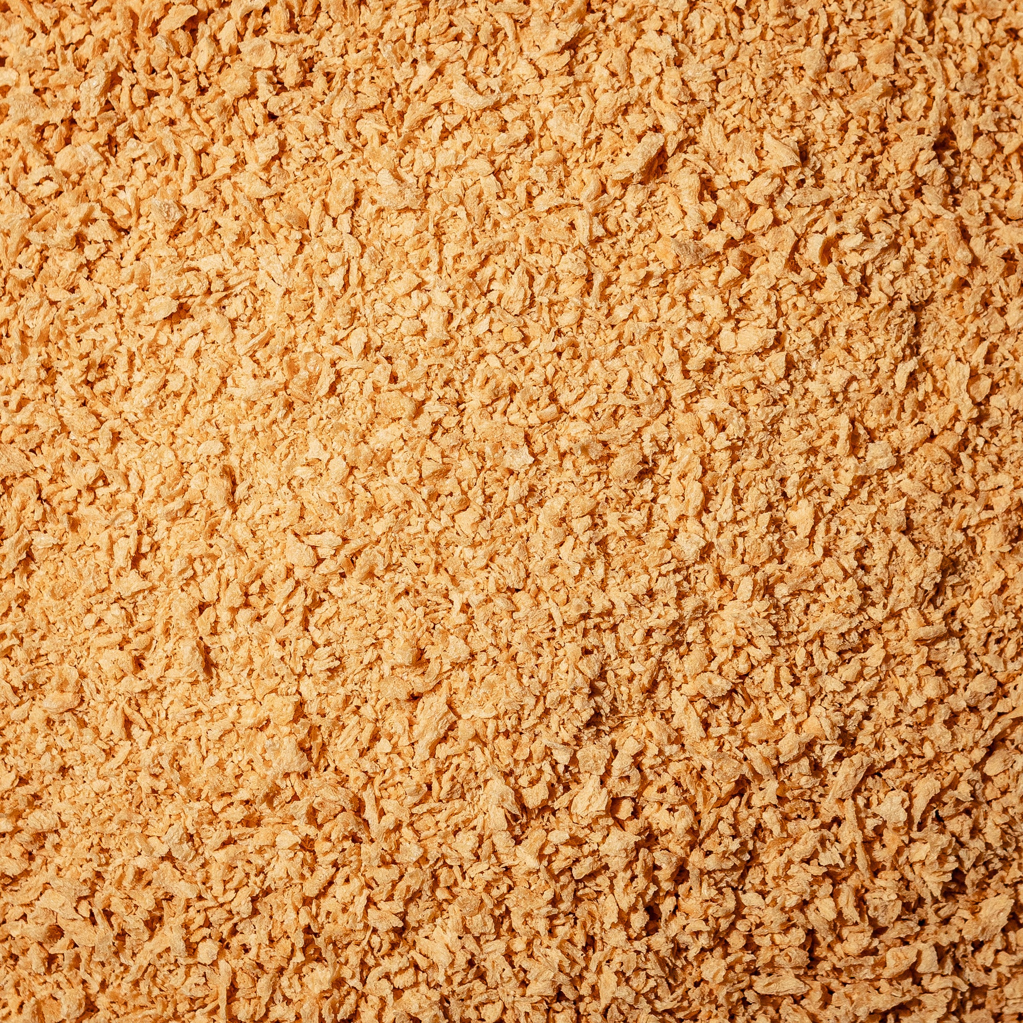 Gros plan sur la Mini OG de Grounded. Protéine végétale texturée nature à base de pois jaunes canadiens, en format fin semblable à de la chapelure, idéale pour intégrer dans des recettes sucrées ou salées.